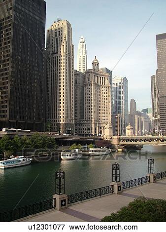 Stock Photo -  Chicago, IL, Illinois, Windy City, Downtown, skyline, Michigan Avenue Bridge, sightseeing tour boats, Chicago River. Fotosearch