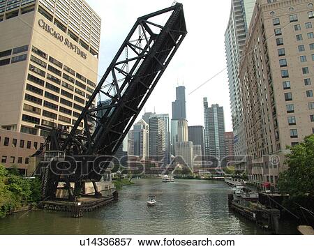 Stock Photo -  Chicago, IL, Illinois, Windy City, Downtown, skyline, North Branch Chicago River, railroad drawbridge raised. Fotosearch