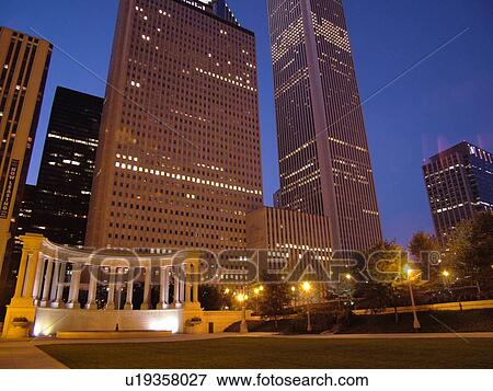 Chicago, IL, Illinois, Windy City, Downtown, skyline, Millennium Park, Wrigley Square, Millennium Monument, semi-circular row of peristyle columns, evening View Large Photo Image Stock Photo - Chicago, IL, Illinois, Windy City, Downtown, skyline, Millennium Park, Wrigley Square, Millennium Monument, semi-circular row of peristyle columns, evening. Fotosearch