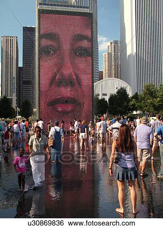 Chicago, IL, Illinois, Windy City, Downtown, Millennium Park, Crown Fountain, people cooling off, hot summer day, face, video image on wall, mural View Large Photo Image Stock Photograph - Chicago, IL, Illinois, Windy City, Downtown, Millennium Park, Crown Fountain, people cooling off, hot summer day, face, video image on wall, mural. Fotosearch