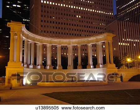 Stock Photography -  Chicago, IL, Illinois, Windy City, Downtown, skyline, Millennium Park, Wrigley Square, Millennium Monument, semi-circular row of peristyle columns, evening. Fotosearch