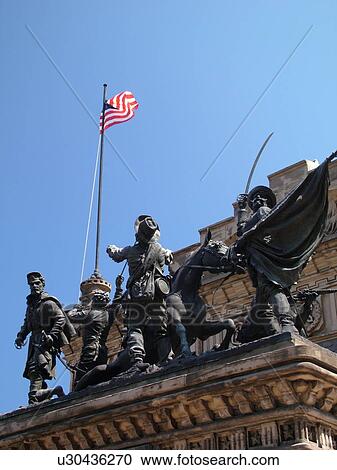 Stock Image -  Cleveland, OH, Ohio, Downtown, Public Square, War Memorial Statue, American Flag. Fotosearch
