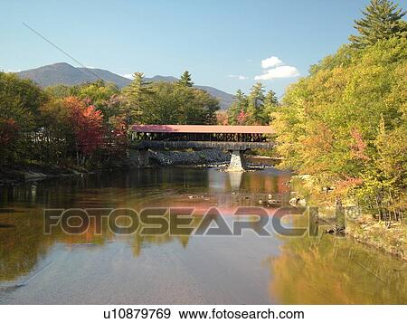 Stock Photo -  Conway, NH, New Hampshire, White Mountains, Saco River, Covered Bridge. Fotosearch