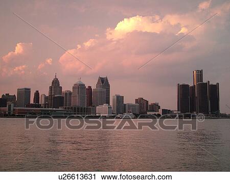 Stock Image -  Detroit, MI, Michigan, Downtown skyline, Detroit River, from Windsor, Ontario, Canada, sunset. Fotosearch