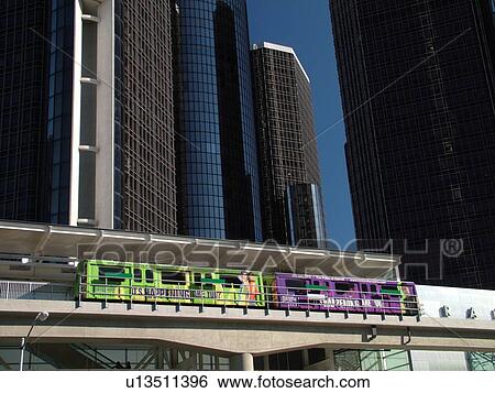 Stock Photograph -  Detroit, MI, Michigan, Motor City, Downtown, skyline, General Motors Headquarters, Renaissance Center, Detroit People Mover, aerial trolley, elevated light-rail system. Fotosearch
