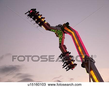 Stock Image -  Essex Junction, VT, Vermont, Champlain Valley Fair, amusement ride, evening. Fotosearch