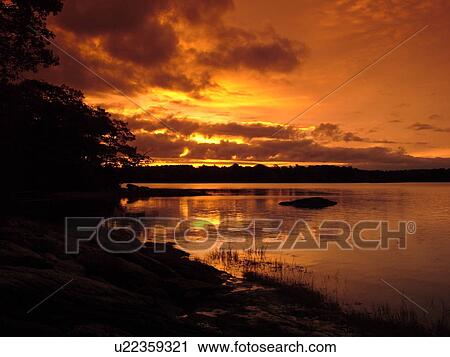 Stock Image -  Freeport, ME, Maine, Casca Bay, Wolf Neck State Park, sunrise, scenic coastline. Fotosearch