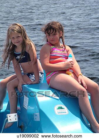 Groton, VT, Vermont, Lake Groton, Groton State Forest, two young girls on a blue paddleboat View Large Photo Image Stock Image - Groton, VT, Vermont, Lake Groton, Groton State Forest, two young girls on a blue paddleboat. Fotosearch