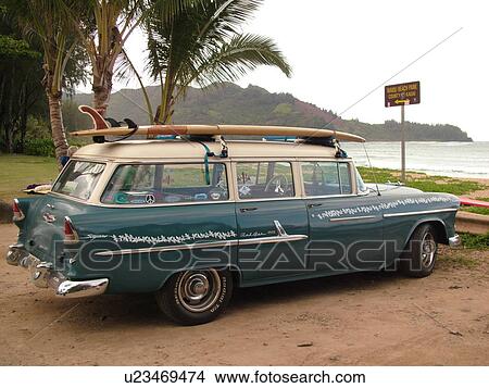 Picture -  Hanalei, Princeville, Kauai, HI, Hawaii, North Shore, Hanalei Bay, Waioli Beach Park, 55 Chevrolet station wagon, surfboard. Fotosearch