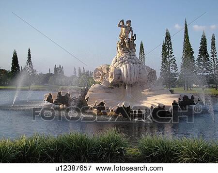Stock Photo -  Hanalei, Princeville, Kauai, HI, Hawaii, North Shore, Fountain and statue of Neptune at the entrance of a resort complex. Fotosearch