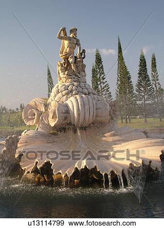 Stock Photo -  Hanalei, Princeville, Kauai, HI, Hawaii, North Shore, Fountain and statue of Neptune at the entrance of a resort complex. Fotosearch
