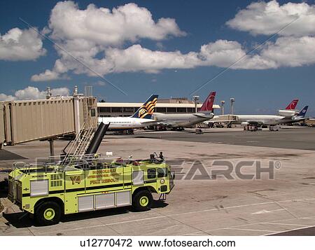 Stock Image -  Honolulu, Oahu, HI, Hawaii, Honolulu International Airport, yellow fire truck. Fotosearch