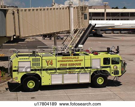 Stock Photo -  Honolulu, Oahu, HI, Hawaii, Honolulu International Airport, yellow fire truck. Fotosearch