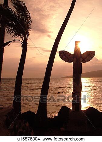 Picture -  Kihei, Maui, HI, Hawaii, Captain Vancouver Monument, totem pole, sunset. Fotosearch