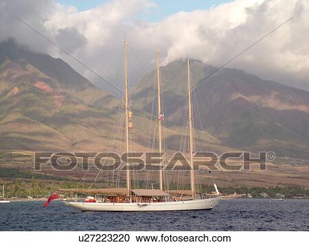 Stock Image -  Lahaina, Maui, HI, Hawaii, West Maui, Auau Channel, schooner, windjammer, West Maui Mountains. Fotosearch