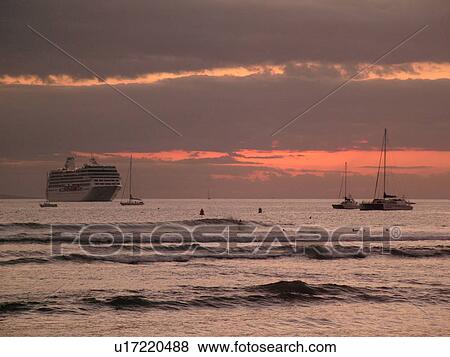 Stock Photo -  Lahaina, Maui, HI, Hawaii, West Maui, Lahaina Harbor, Auau Channel, sunset, cruise ship. Fotosearch