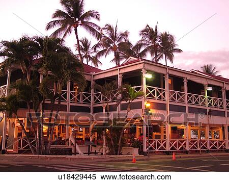 Stock Photography -  Lahaina, Maui, HI, Hawaii, West Maui, Historic Downtown, Historic Pioneer Inn, evening. Fotosearch