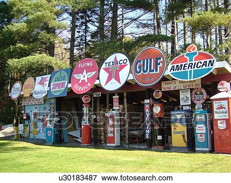 Stock Photo -  Littletown, NH, New Hampshire, Antique Gas Station Signs, Pumps, fuel companies. Fotosearch