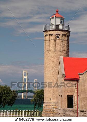 Stock Photo -  Mackinaw City, MI, Michigan, Lake Michigan, Lake Huron, lighthouse, Mackinaw Bridge. Fotosearch