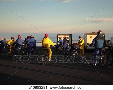 Stock Image -  Maui, HI, Hawaii, Haleakala National Park, Haleakala Visitor Center Overlook, volcano, bikers, Biking down the Volcano. Fotosearch