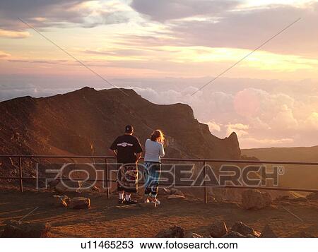 Stock Image -  Maui, HI, Hawaii, Haleakala National Park, Haleakala Visitor Center Overlook, volcano, sunrise. Fotosearch