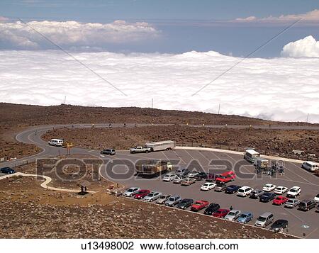 Stock Image -  Maui, HI, Hawaii, Haleakala National Park, Haleakala Visitor Center Overlook, parking lot. Fotosearch