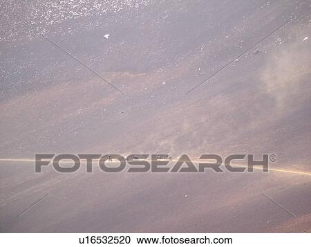 Stock Image -  Maui, HI, Hawaii, Haleakala National Park, horseback riding on the volcano, Sliding Sand Trail. Fotosearch