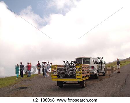 Stock Photo -  Maui, HI, Hawaii, Upcountry, Haleakala Highway, Bikers on Haleakala Crater Road, overlook, bike tour. Fotosearch