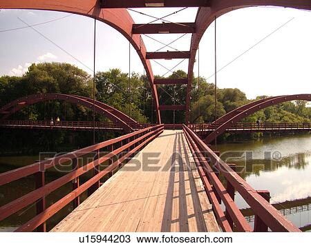Midland, MI, Michigan, The Tridge, three-legged pedestrian bridge crosses the Tittabawasee and Chippewa Rivers View Large Photo Image Stock Image -  Midland, MI, Michigan, The Tridge, three-legged pedestrian bridge crosses the Tittabawasee and Chippewa Rivers. Fotosearch
