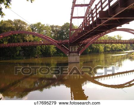 Midland, MI, Michigan, The Tridge, three-legged pedestrian bridge crosses the Tittabawasee and Chippewa Rivers View Large Photo Image Stock Photo - Midland, MI, Michigan, The Tridge, three-legged pedestrian bridge crosses the Tittabawasee and Chippewa Rivers. Fotosearch