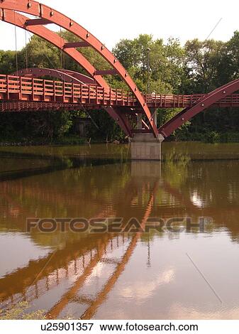Stock Photo -  Midland, MI, Michigan, The Tridge, three-legged pedestrian bridge crosses the Tittabawasee and Chippewa Rivers. Fotosearch