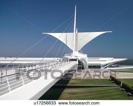 Stock Image -  Milwaukee, WI, Wisconsin, Downtown, Milwaukee Art Museum, Lake Michigan, lakefront, Reiman Foundation Bridge, Connecting Life and Art, pedestrian walkway. Fotosearch