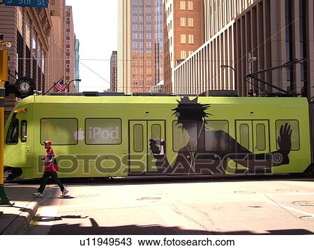 Stock Image -  Minneapolis, MN, Minnesota, Twin Cities, Downtown, Metro Transit, light rail, tram, train, IPOD advertising. Fotosearch
