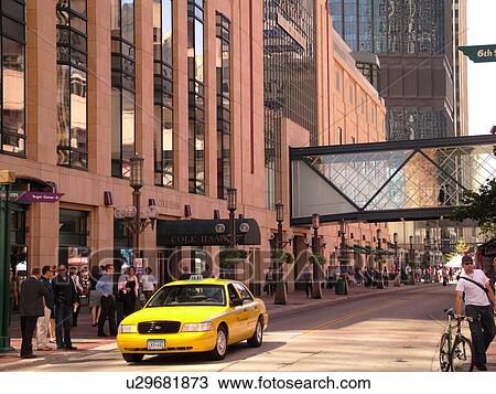 Stock Image -  Minneapolis, MN, Minnesota, Twin Cities, Downtown, Nicollet Avenue, yellow taxi. Fotosearch