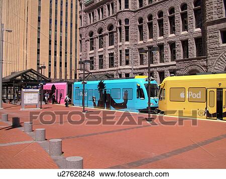 Stock Photo -  Minneapolis, MN, Minnesota, Twin Cities, Downtown, Government Plaza, Metro Transit, light rail, tram, train, IPOD advertising. Fotosearch
