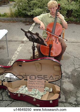 Stock Image -  Montpelier, VT, Vermont, Farmer's Market, street musician, cello, donations, save the musicians. Fotosearch