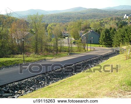 Stock Image -  Montpelier, VT, Vermont, Second Greaves Condominium Complex, driveway, road. Fotosearch