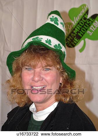 Stock Image -  Montpelier, VT, Vermont, St. Patrick's Day, woman wearing festive hat. Fotosearch
