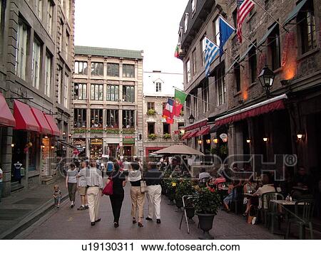 Stock Image -  Montreal, Canada, QC, Quebec, Old Port, Old Montreal, Rue Saint Vincent, outdoor cafTs and shops. Fotosearch