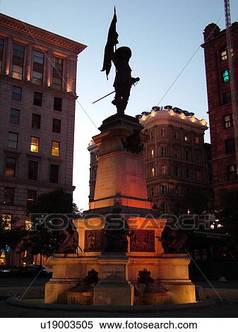 Stock Photography -  Montreal, Canada, QC, Quebec, Old Montreal, Place d'Armes, Maisonneuve Statue, founder of Montreal, evening. Fotosearch
