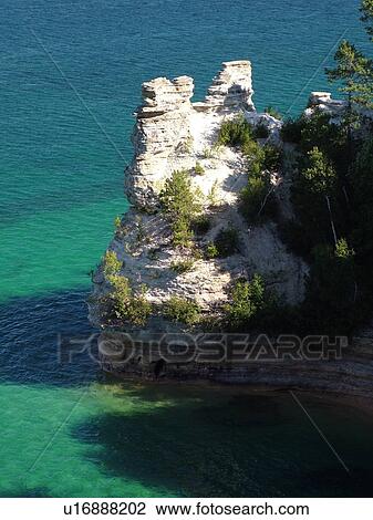 Stock Image -  Munising, MI, Michigan, Lake Superior, Pictured Rocks National Lakeshore, Miners Castle from Overlook. Fotosearch