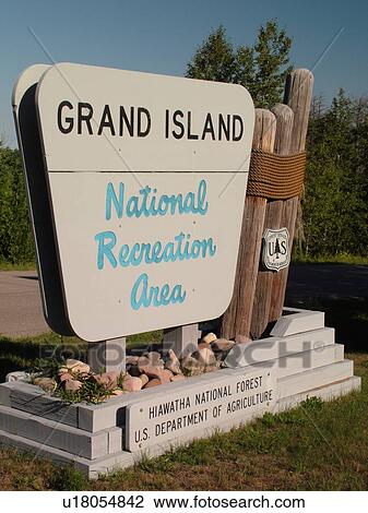 Stock Image -  Munising, MI, Michigan, Lake Superior, Grand Island National Recreation Area, Hiawatha National Forest, entrance sign. Fotosearch