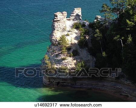 Stock Photo -  Munising, MI, Michigan, Lake Superior, Pictured Rocks National Lakeshore, Miners Castle from Overlook. Fotosearch