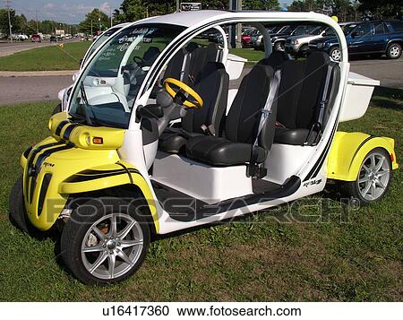 Stock Image -  Petoskey, MI, Michigan, Electric cars, GEM, Global Electric Motorcars, Daimler/Chrysler Company. Fotosearch