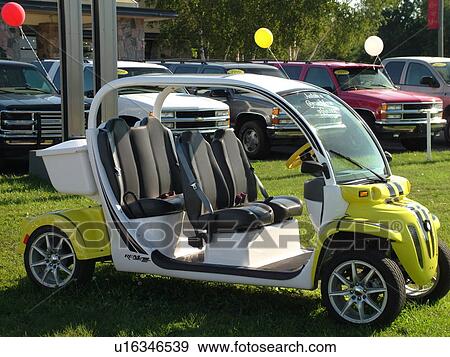 Stock Photo -  Petoskey, MI, Michigan, Electric cars, GEM, Global Electric Motorcars, Daimler/Chrysler Company. Fotosearch