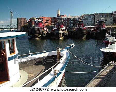 Stock Image -  Portsmouth, NH, New Hampshire, Piscataqua River, Barker's Wharf, Old Harbor, Tug Boats, The Tuggs. Fotosearch