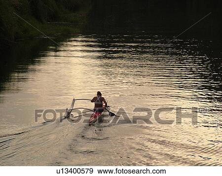 Stock Photo -  Princeville, Kauai, HI, Hawaii, North Shore, Hanalei Valley, Hanalei River, outrigger canoe. Fotosearch