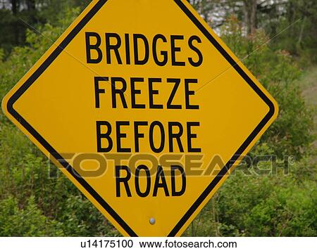 Stock Image -  road sign, Bridges Freeze Before Road, warning sign, . Fotosearch