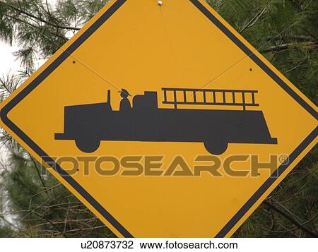 Stock Image -  road sign, Emergency Vehicles Entering Highway sign, fire station ahead, warning sign. Fotosearch