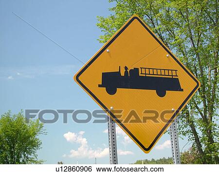 Stock Photograph -  road sign, Emergency Vehicles Entering Highway sign, fire station ahead, warning sign. Fotosearch
